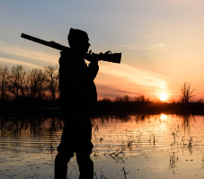 silhouette of a hunter at sunset