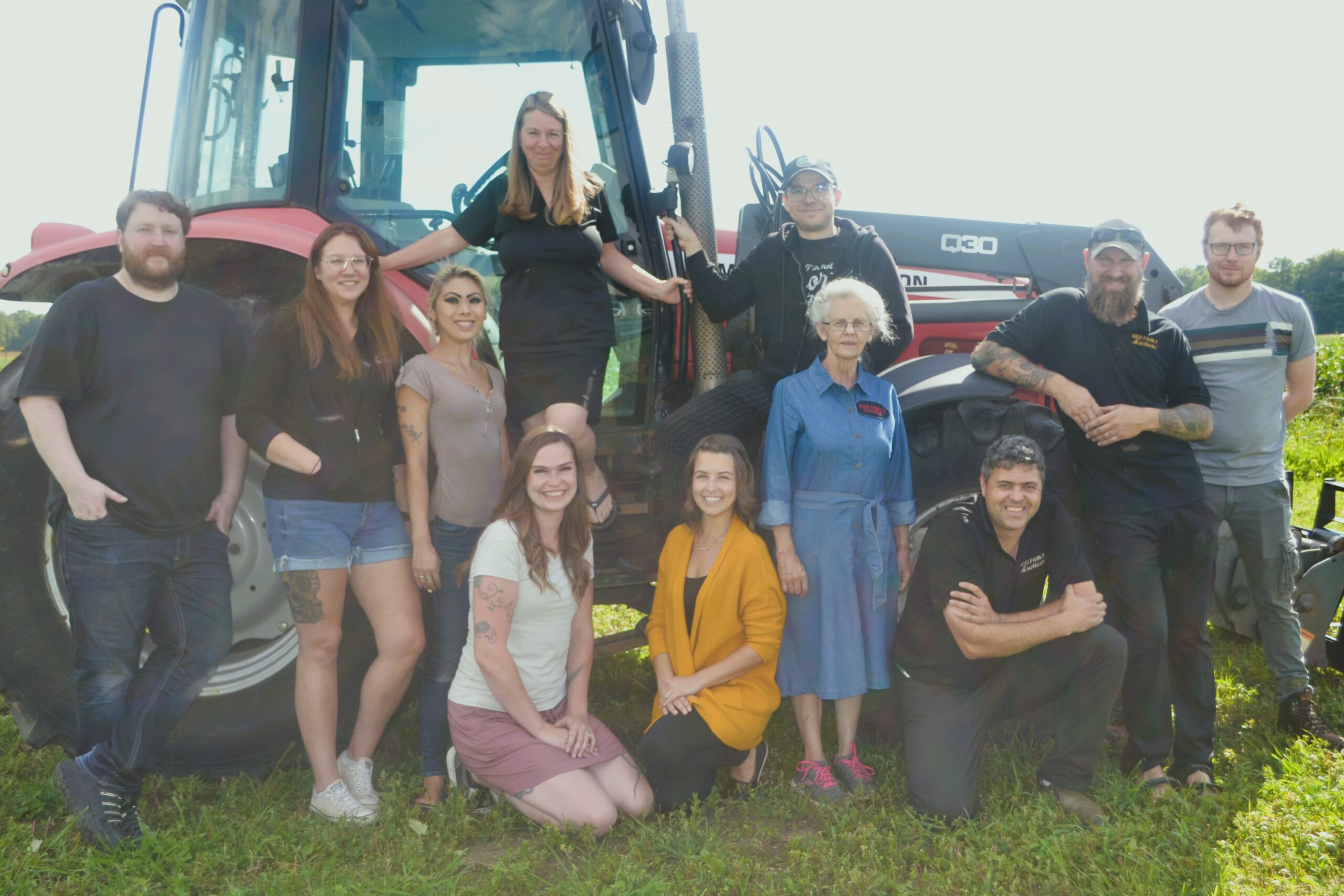 Staff photo with farming equipment