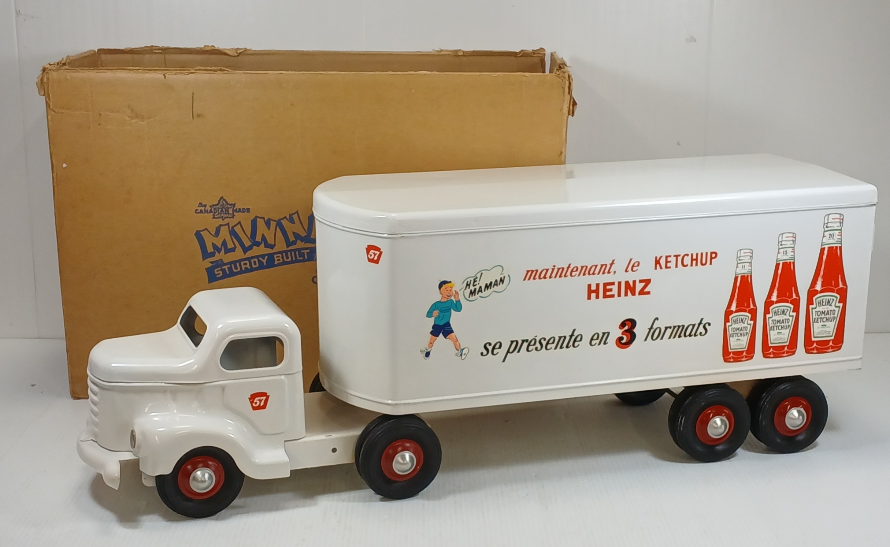 VINTAGE WHITE HEINZ TRUCK WITH ORIGINAL BOX BEHIND IT.